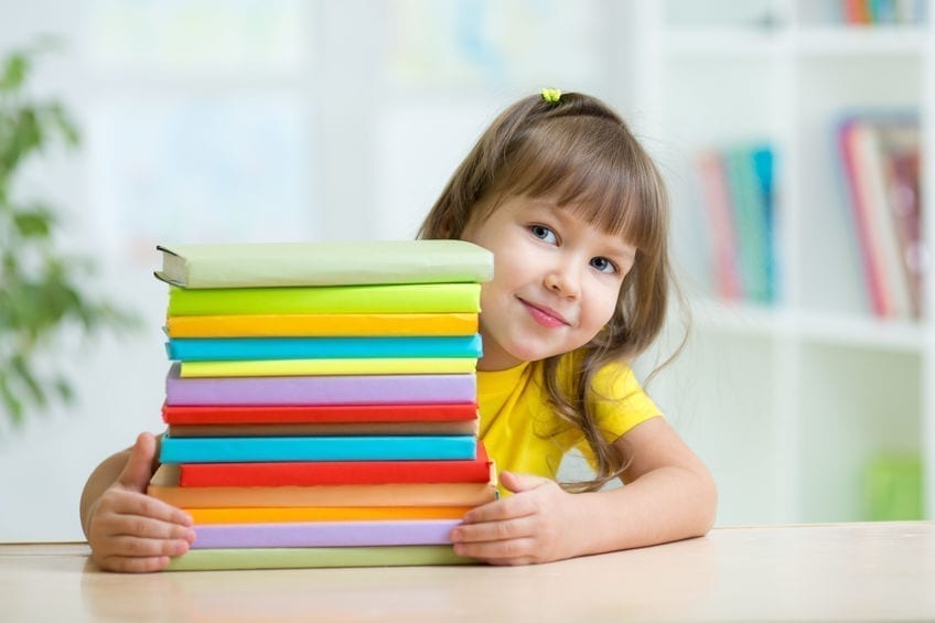 Smart kid girl preschooler with books Smart kid girl preschooler with books