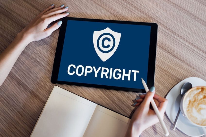 Copyright icon on screen. Patent Law and Intellectual Property. Business, Internet and Technology Concept. Copyright icon on screen. Patent Law and Intellectual Property. Business, Internet and Technology Concept.